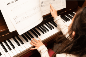 Student playing piano